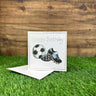 Football boots and football white card and envelope.