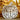 Wooden pumpkin decoration with twine on a background of autumn leaves