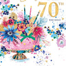 Greeting card with colorful flowers and '70th Birthday' text for a sister on a white background