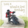 Figure on motorbike leaning into the bend wearing black and red leather jacket. Birthday card.
