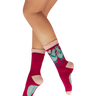 Red socks with cartoon characters worn by a person on a white background