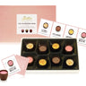 Box of chocolates with tasting cards on a white background