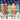 Illustration of a festive street scene with colorful buildings and people in winter clothing.